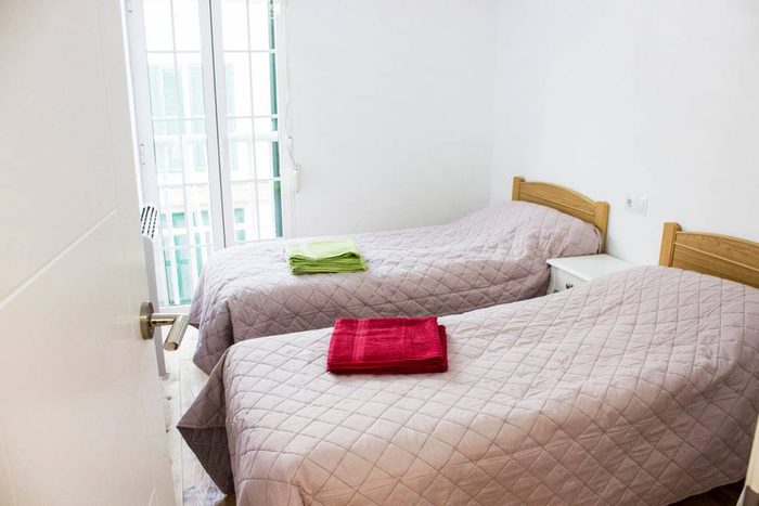 Chambre avec deux lits simples